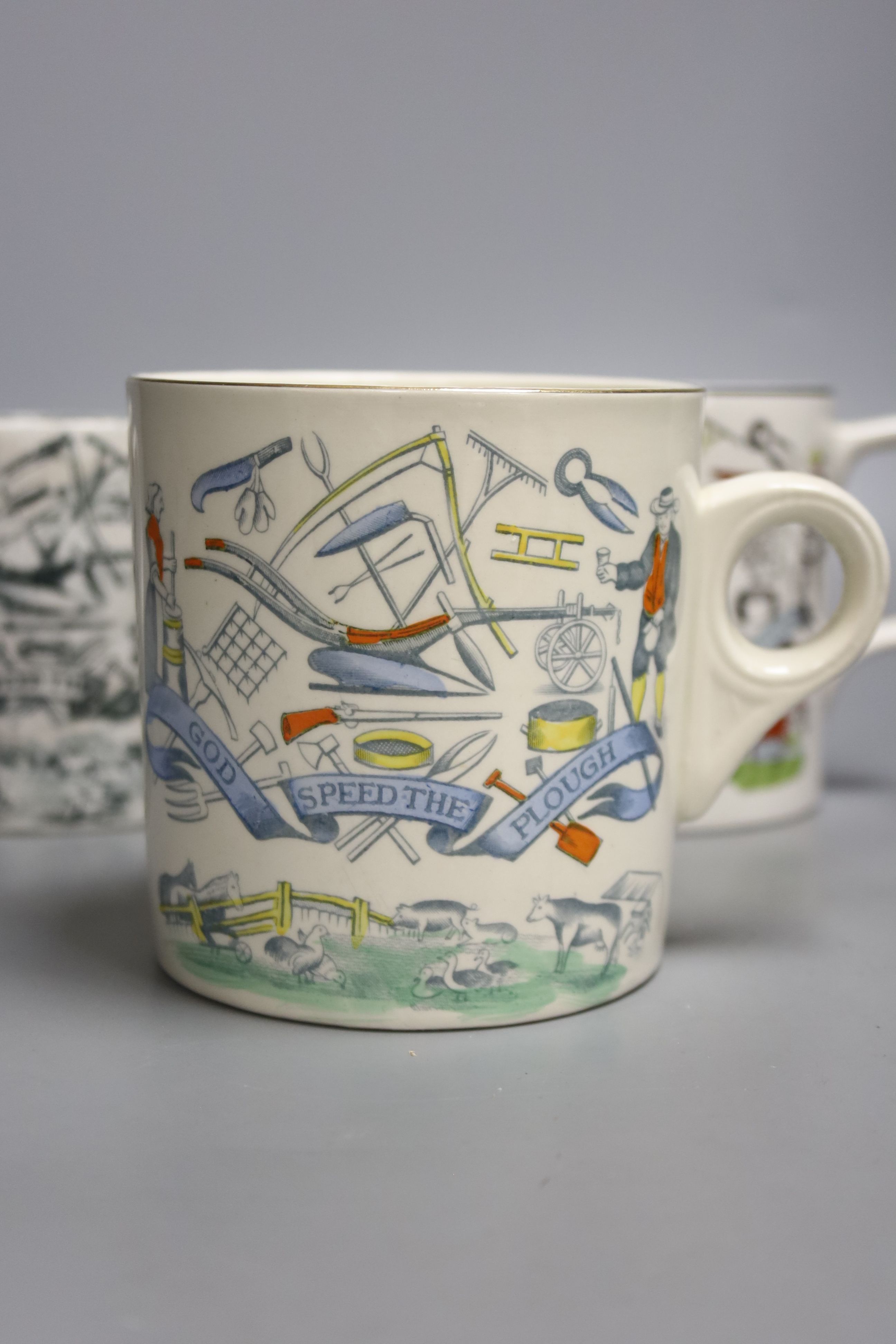 An Eric Ravilious Elizabeth II coronation mug and three 'speed the plough' mugs